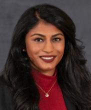 woman with long dark hair smiling