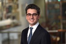 man with glasses on smiling