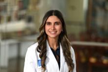 woman with long, highlighted hair smiling