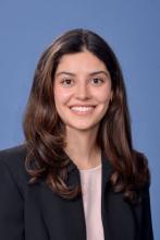 woman with medium-length brown hair smiling