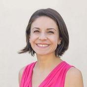 woman with short brown hair smiling