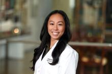 woman with long, blowed out hair smiling