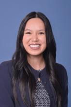 woman with long dark hair smiling