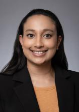 woman with dark hair smiling