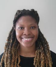 woman with a black top on smiling