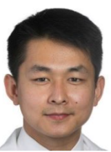 man with short dark hair smiling