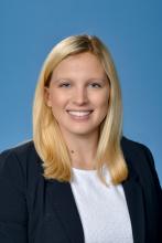 woman with shoulder length blonde hair smiling