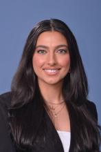 woman with long dark hair smiling