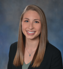 woman with dark blonde hair smiling