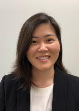 woman with dark brown hair smiling