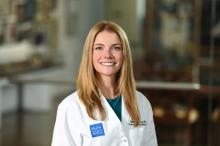 woman with straight, blonde hair smiling