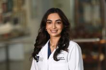 woman with long, dark hair smiling