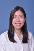 woman with shoulder length dark hair smiling
