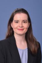 woman in a lavendar top smiling