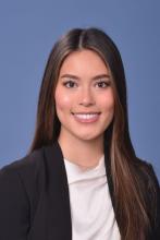 woman with long brown hair smiling