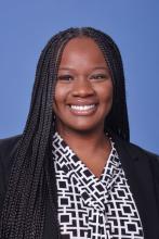 woman with long dark hair smiling