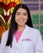 woman with straight, dark hair smiling