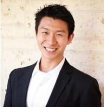 man in a suit smiling