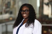 woman with curly hair smiling