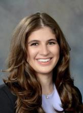 woman with long brown hair smiling
