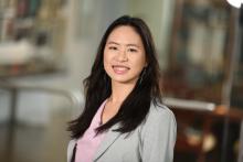 woman with very dark hair smiling