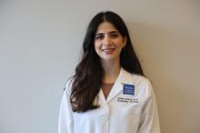woman with long brown hair smiling