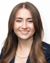 woman with long light brown hair smiling