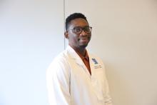 man with glasses on smiling lightly