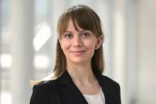woman with light brown hair smiling
