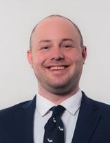 man in a suit smiling