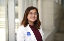 woman with shoulder length hair and glasses on smiling