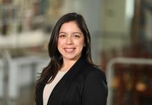 woman with dark hair smiling