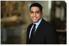 man with short dark hair smiling