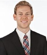 man with blonde hair smiling