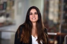woman with very long, dark brown hair smiling