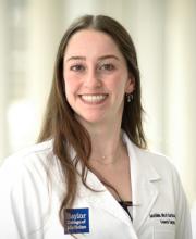woman with long brown hair smiling