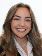 woman with dark blonde hair smiling