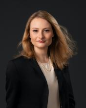 woman with blonde hair smiling lightly