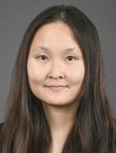 woman with long stright hair smiling lightly