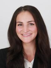 woman with long brown hair smiling