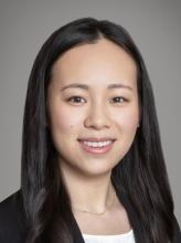 woman with long dark hair smiling