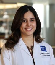 woman with dark hair smiling