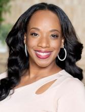 woman in a white blouse smiling