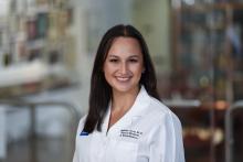 woman with long dark hair smiling