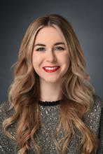 woman with long, blonde hair smiling