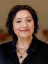 woman with short dark hair smiling