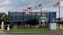 a VA hospital with flags in front of it