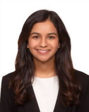 woman with long dark hair smiling