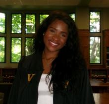 woman with long dark hair smiling