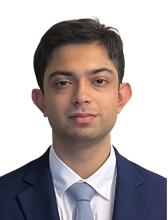 man in a blue suit smiling lightly